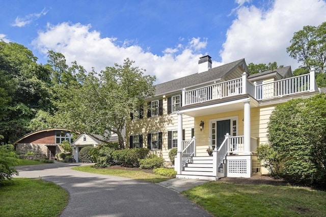 44 Ripley Hill Rd, Concord, MA 01742 - view of front of house with a balcony and a chimney