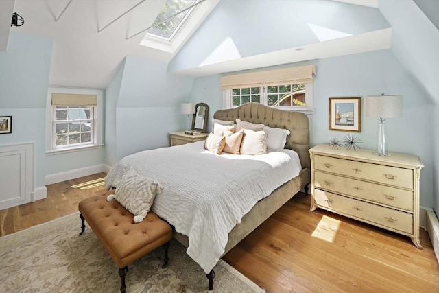 44 Ripley Hill Rd, Concord, MA 01742 - bedroom featuring a skylight, vaulted ceiling, and wood finished floors