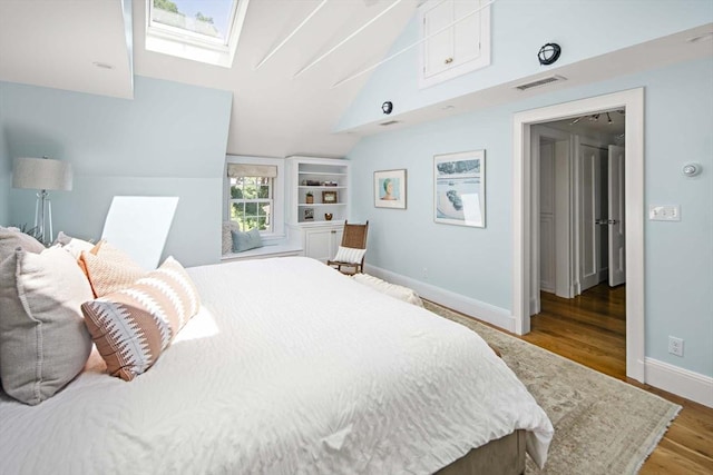 44 Ripley Hill Rd, Concord, MA 01742 - bedroom with a skylight, lofted ceiling, and wood finished floors
