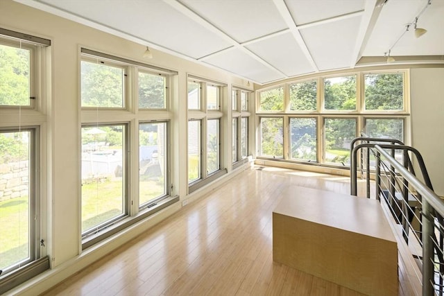 44 Ripley Hill Rd, Concord, MA 01742 - unfurnished sunroom with healthy amount of natural light, beamed ceiling, and wood-type flooring
