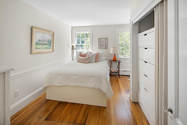 44 Ripley Hill Rd, Concord, MA 01742 - bedroom with light wood finished floors and baseboard heating