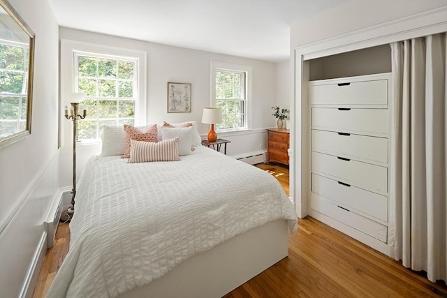 44 Ripley Hill Rd, Concord, MA 01742 - bedroom with wood finished floors and baseboard heating