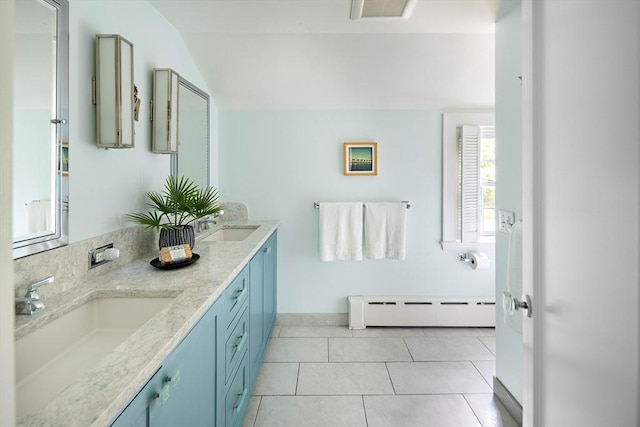 44 Ripley Hill Rd, Concord, MA 01742 - bathroom featuring a baseboard heating unit, vaulted ceiling, double vanity, and tile patterned flooring