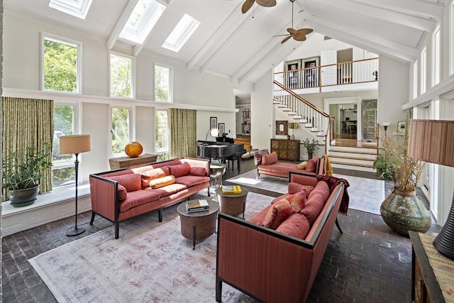 44 Ripley Hill Rd, Concord, MA 01742 - living area with brick floors, high vaulted ceiling, ceiling fan, stairway, and a skylight