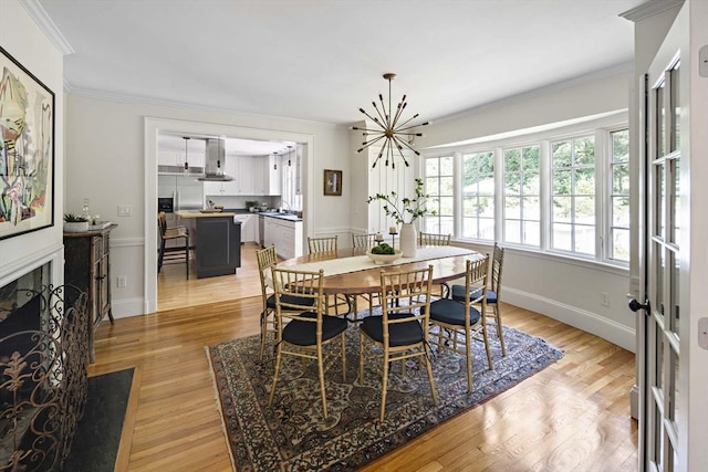 44 Ripley Hill Rd, Concord, MA 01742 - dining space featuring light wood-style floors, crown molding, and a chandelier
