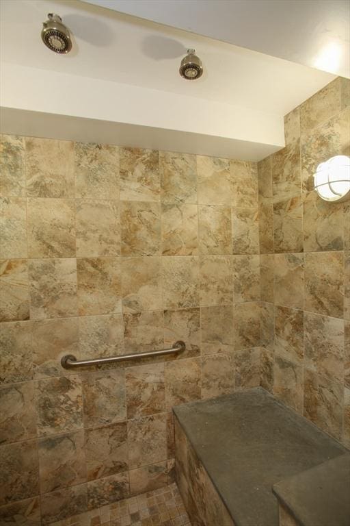 full bathroom with tiled shower