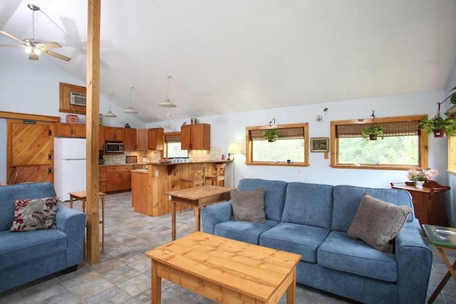 living room featuring high vaulted ceiling, an AC wall unit, and ceiling fan