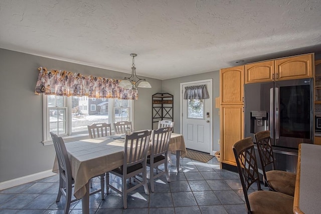 dining area with a textured ceiling