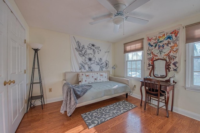 bedroom with ceiling fan, a closet, and light wood-type flooring