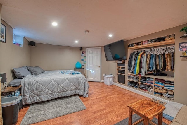 bedroom featuring a closet and light hardwood / wood-style flooring