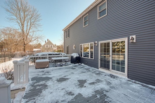 view of snow covered deck