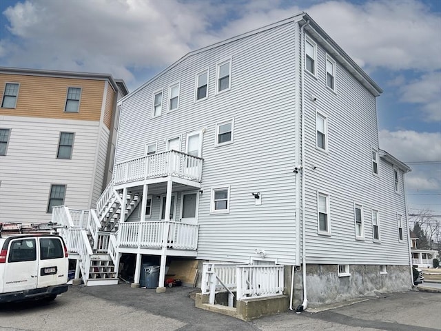 back of house with stairway