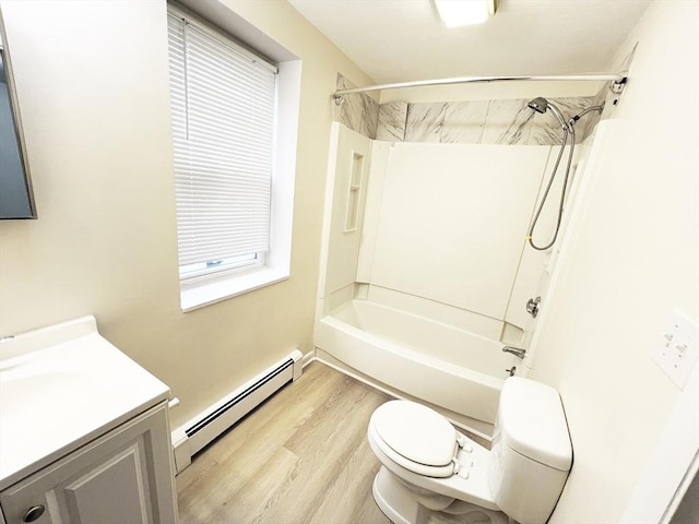 full bathroom with baseboard heating, wood finished floors, vanity, toilet, and tub / shower combination