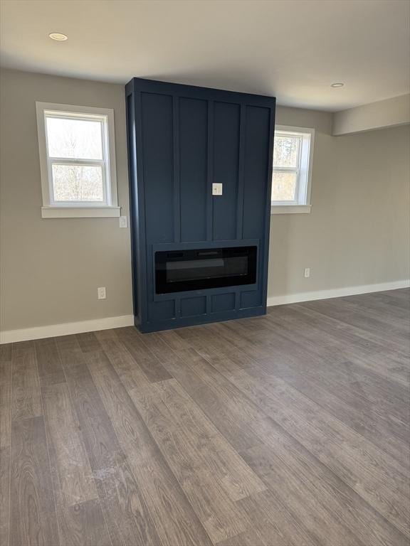 details with baseboards and wood finished floors