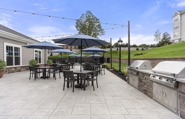 view of patio featuring an outdoor kitchen and area for grilling