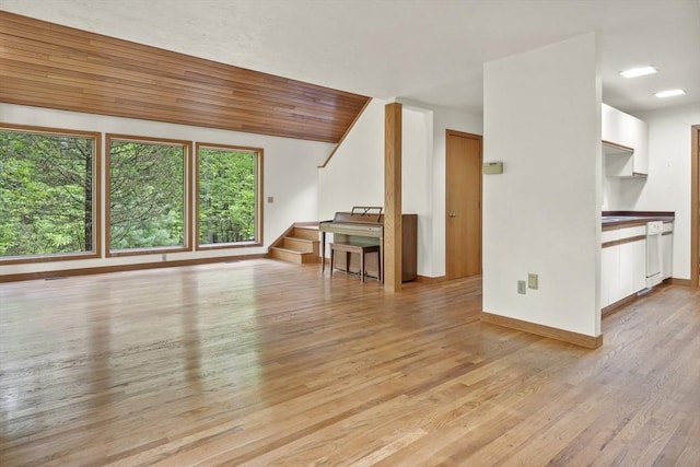 4 Fiske Mill Rd, Upton, MA 01568 - unfurnished living room with light wood-style flooring, baseboards, and stairway