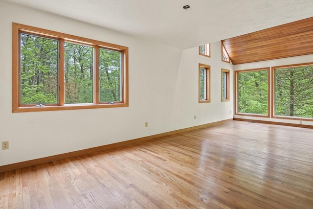 4 Fiske Mill Rd, Upton, MA 01568 - unfurnished room featuring healthy amount of natural light, baseboards, wood finished floors, and vaulted ceiling