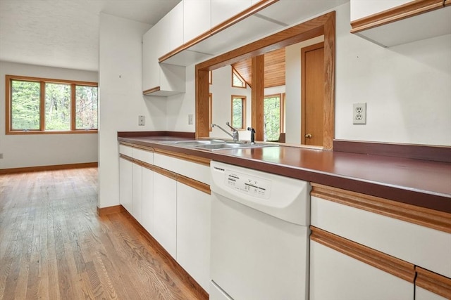4 Fiske Mill Rd, Upton, MA 01568 - kitchen featuring dishwasher, a sink, light wood-type flooring, white cabinetry, and dark countertops