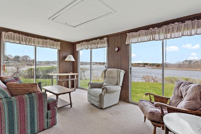 sunroom with a water view