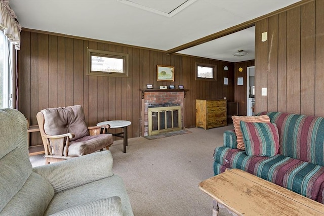 carpeted living area featuring wooden walls and a brick fireplace