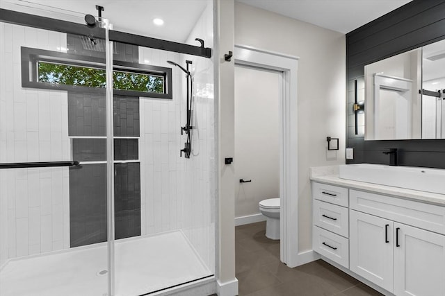 35 Columbia Ave, Lynn, MA 01902 - bathroom featuring a shower stall, toilet, vanity, tile patterned flooring, and baseboards