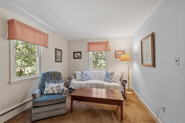 sitting room with baseboards, light colored carpet, and a baseboard radiator
