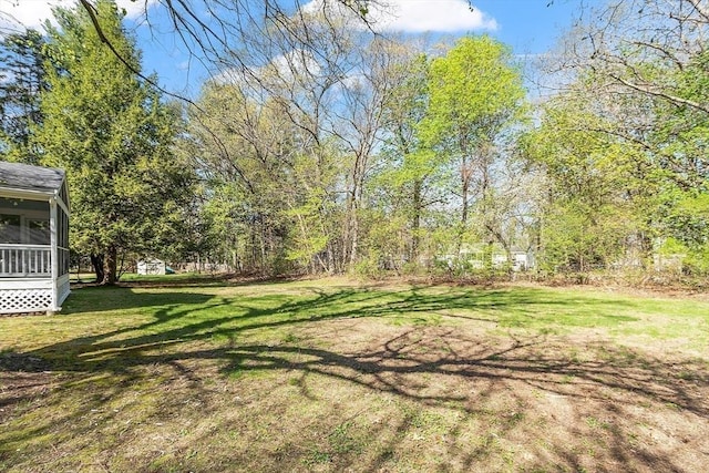 view of yard featuring a sunroom
