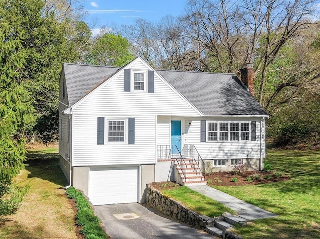 view of front of house with driveway, a chimney, roof with shingles, a garage, and a front lawn