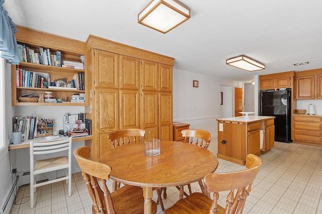 dining area with light tile patterned floors