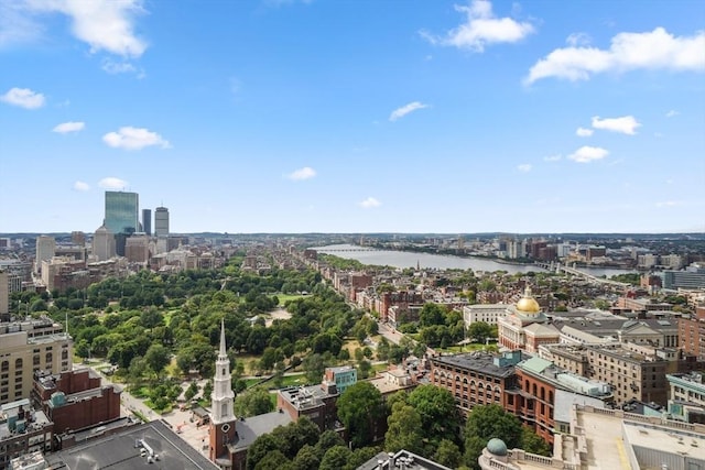 birds eye view of property featuring a view of city and a water view