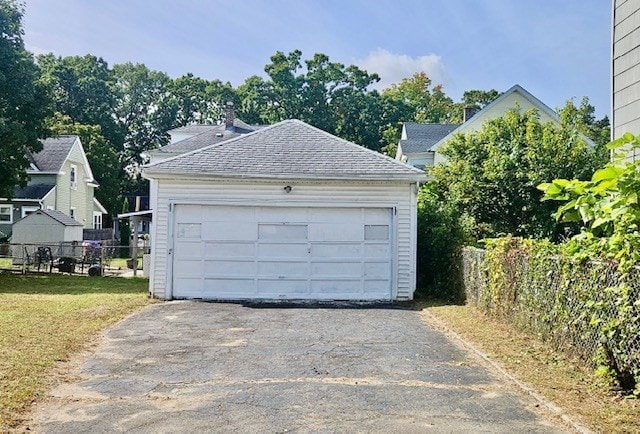 garage with a lawn