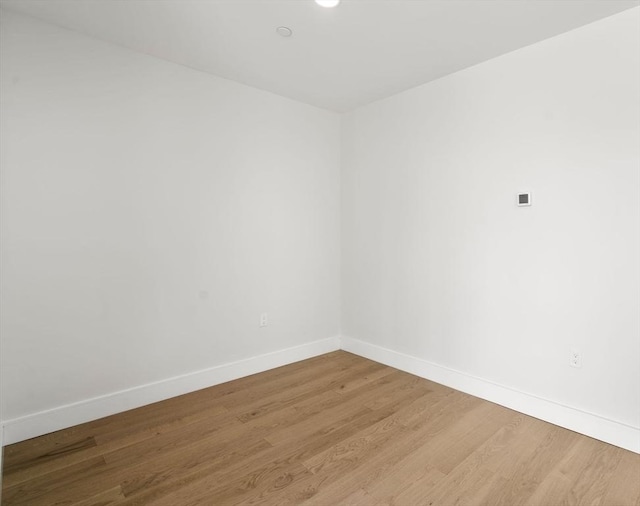 301 Border Unit U606, Boston, MA 02128 - empty room with baseboards, wood finished floors, and recessed lighting