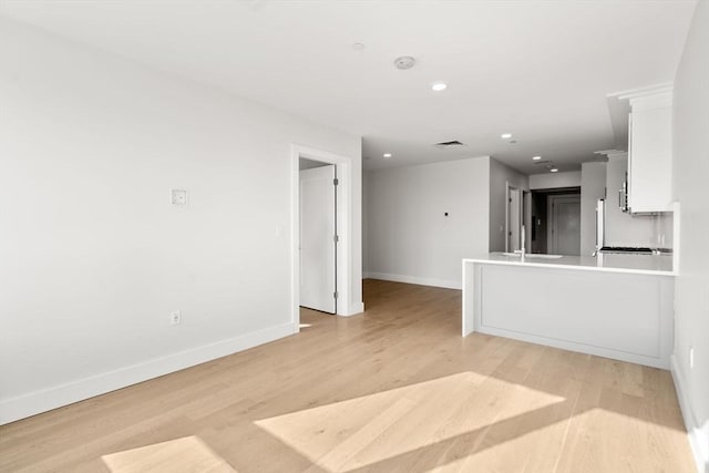 301 Border Unit U606, Boston, MA 02128 - unfurnished living room with baseboards, light wood-type flooring, a sink, and recessed lighting