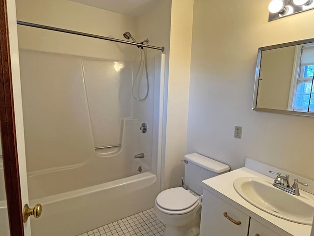 bathroom featuring toilet, tile patterned flooring, bathtub / shower combination, and vanity