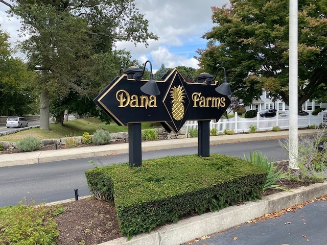 community sign with fence