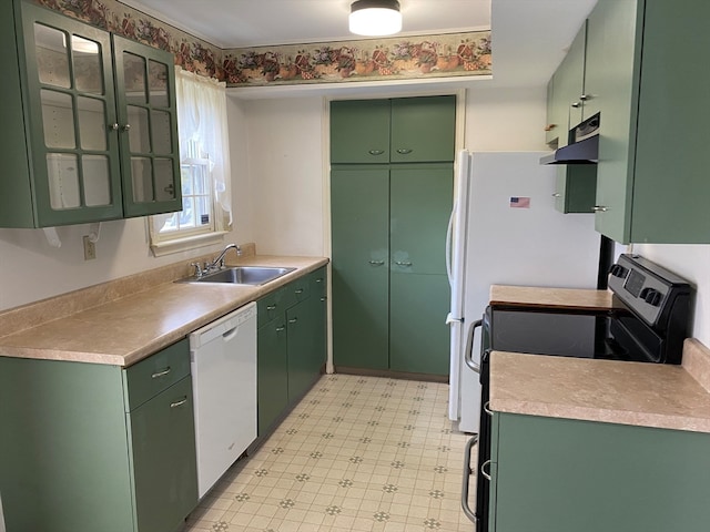 kitchen with green cabinets, dishwasher, sink, and black range