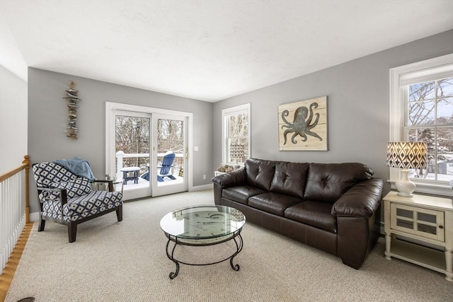 living area featuring baseboards