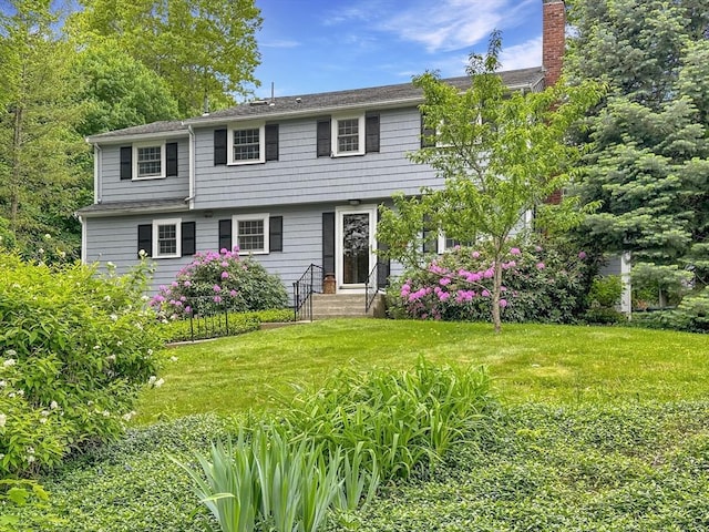 37 Eastview Rd, Hopkinton, MA 01748 - colonial house with a front lawn and a chimney