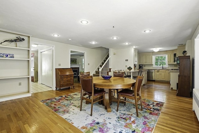 37 Eastview Rd, Hopkinton, MA 01748 - dining space featuring stairway, a fireplace, wood finished floors, and recessed lighting