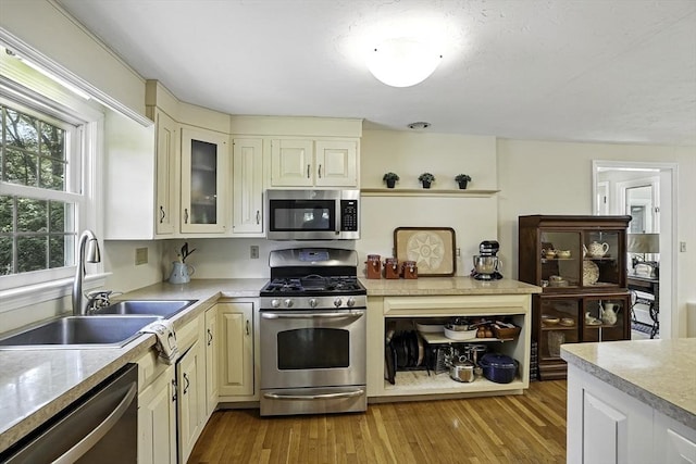 37 Eastview Rd, Hopkinton, MA 01748 - kitchen with stainless steel appliances, a sink, light countertops, and light wood finished floors
