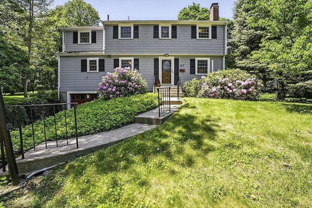 37 Eastview Rd, Hopkinton, MA 01748 - colonial house featuring a chimney, entry steps, and an attached garage