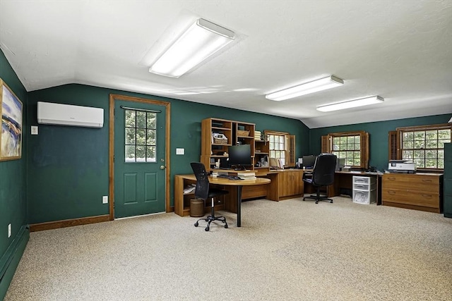 37 Eastview Rd, Hopkinton, MA 01748 - home office featuring a wall unit AC, vaulted ceiling, and light carpet