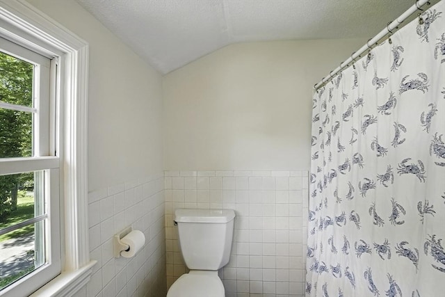 37 Eastview Rd, Hopkinton, MA 01748 - bathroom featuring lofted ceiling, plenty of natural light, toilet, tile walls, and a textured ceiling
