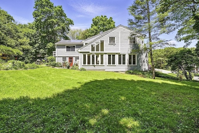 37 Eastview Rd, Hopkinton, MA 01748 - rear view of property featuring a yard