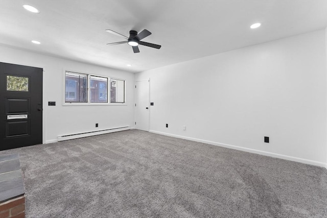 unfurnished room featuring a baseboard heating unit, ceiling fan, and carpet flooring