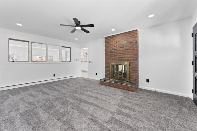 unfurnished living room featuring ceiling fan, carpet, a brick fireplace, and a baseboard heating unit