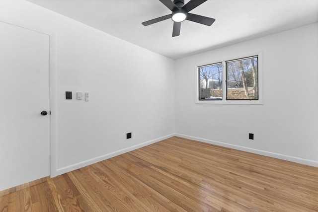 spare room featuring light hardwood / wood-style floors and ceiling fan