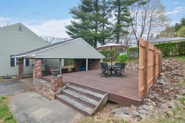 wooden deck with outdoor dining space