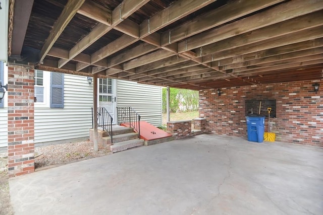 view of patio featuring entry steps and an attached carport