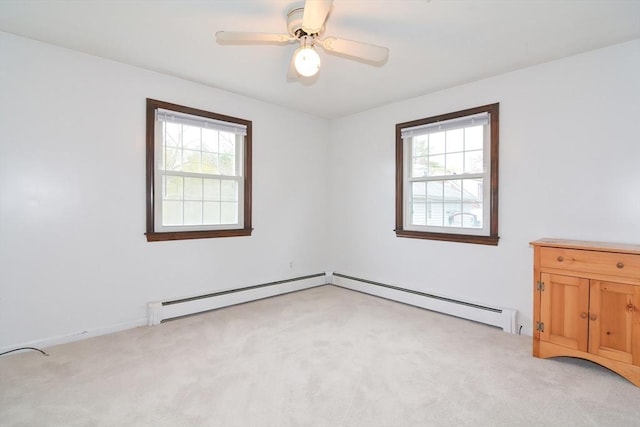 unfurnished room featuring a ceiling fan, a baseboard heating unit, and light carpet